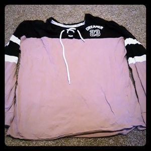 thin long sleeve sweater that is pink and black
